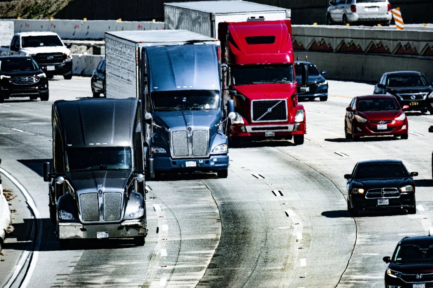 Stock photograph of American trucks and cars traveling on a highway